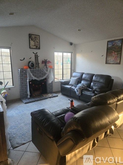 A living room with a fireplace and a couch.