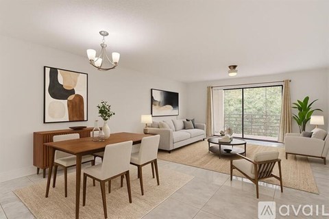 A modern living room with a dining table and chairs.