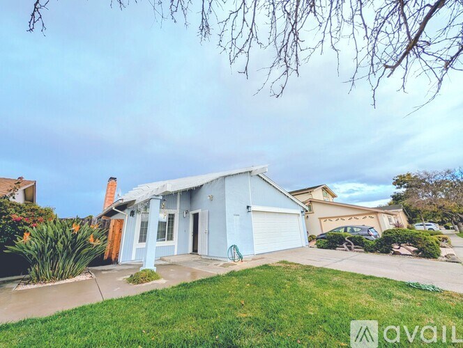 A house with a blue exterior is for sale.