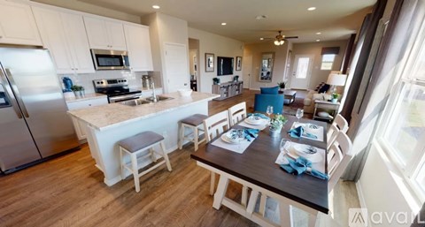 A kitchen with a table set for a meal.
