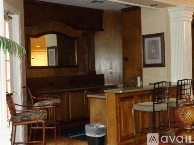 A kitchen with wooden cabinets and a counter.