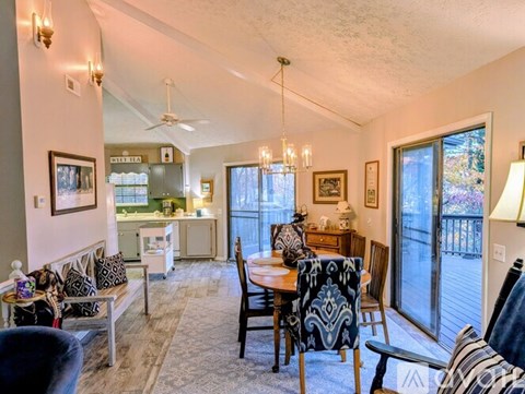 A well-lit dining area with a table set for four.