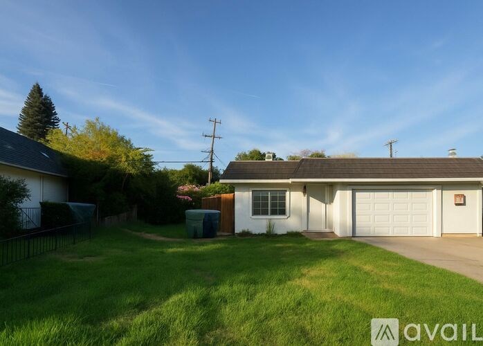 A house with a garage is available for sale.