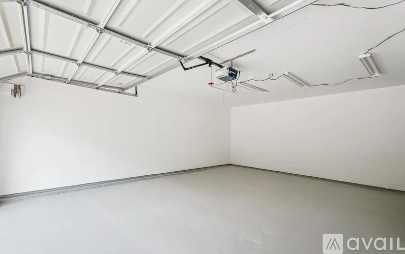 A room with a white ceiling and walls, and a white floor.