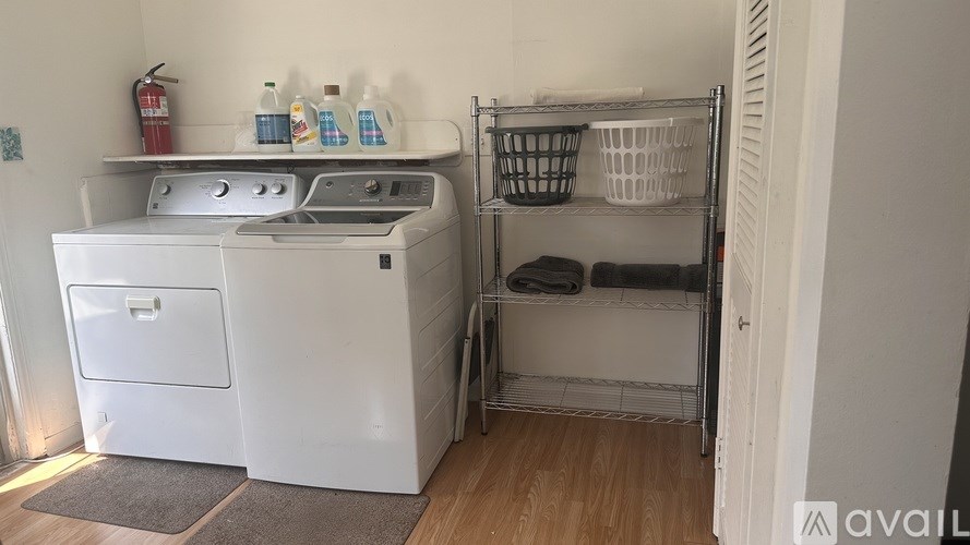 A laundry room with a washing machine and a dryer.