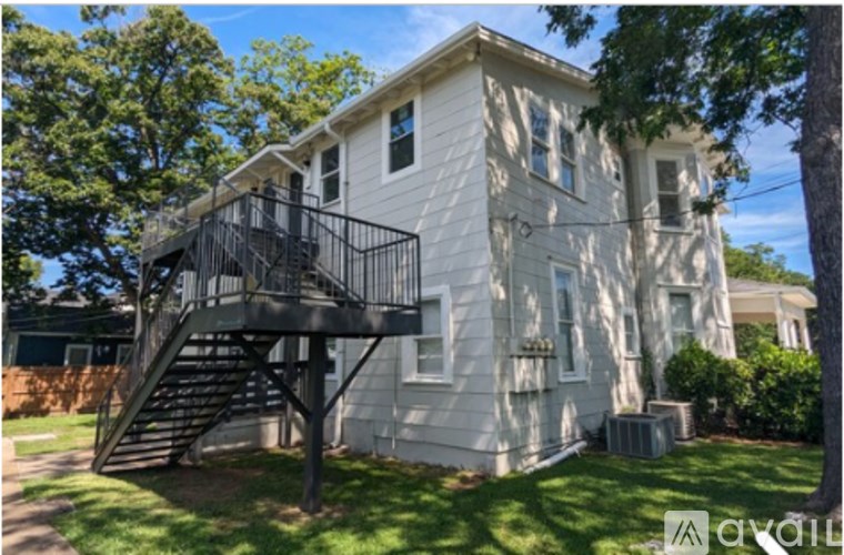 A two-story house with a staircase leading to the second floor.