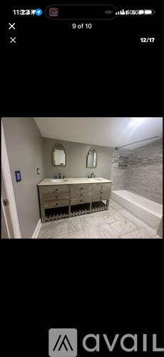 A bathroom with a vanity and a bathtub.