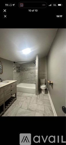 A bathroom with a walk-in shower and a toilet.