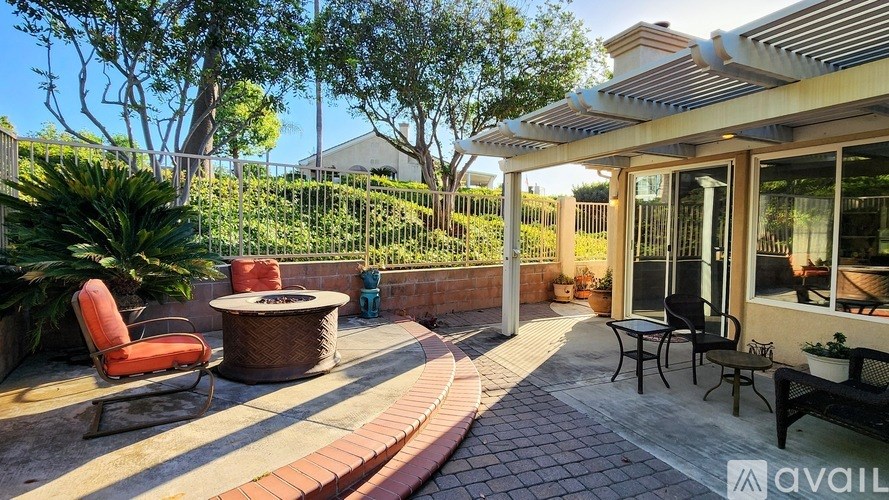 A patio with a table and chairs is available for rent.