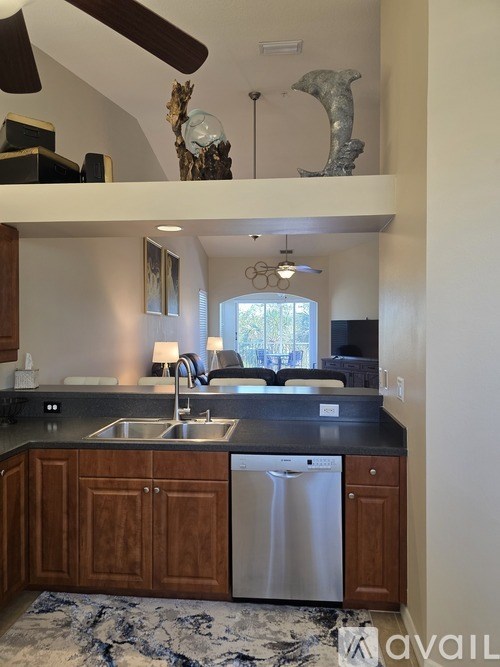 A kitchen with a sink and a window.