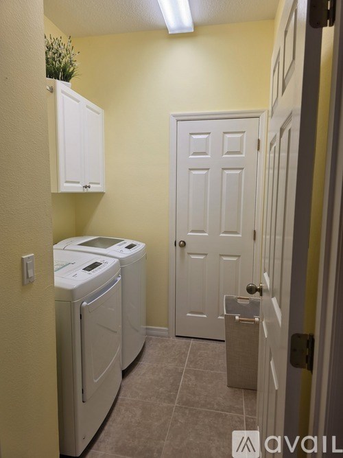 A laundry room with a washer and dryer.