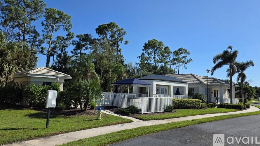 A row of houses with a sign in front of the first one.