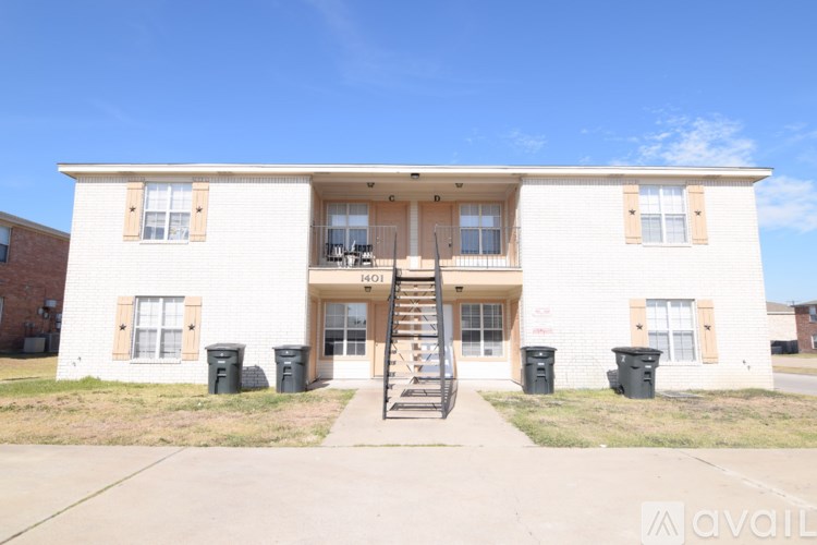 A two-story building with the number 1401 on the front door.