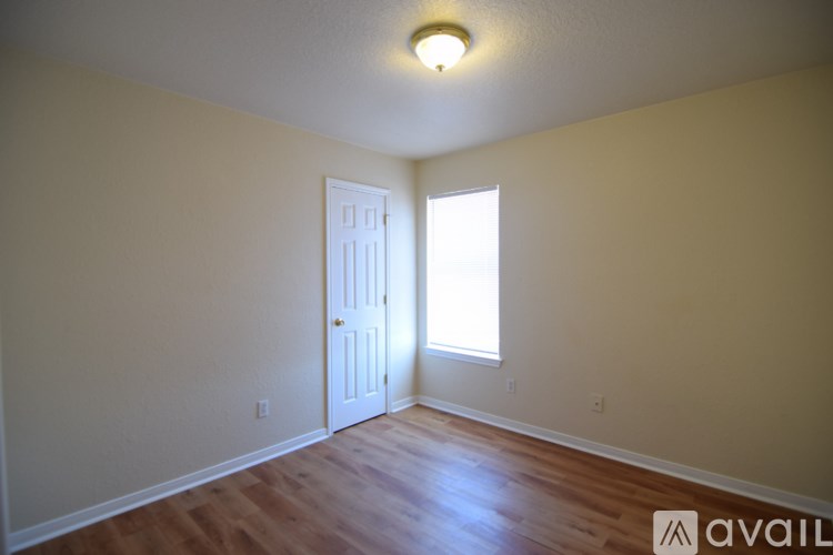 A room with a door and a window.