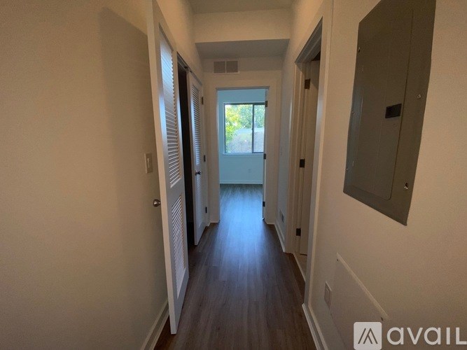 A long hallway with a door at the end.