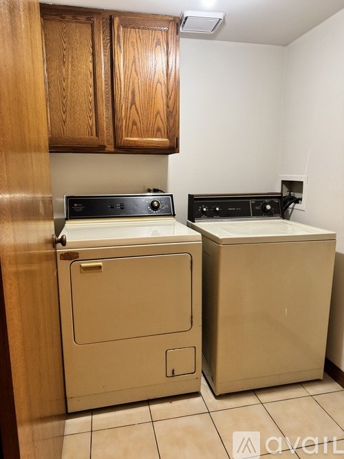A small kitchen with a stove and a dishwasher.