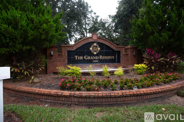 The Grand Reserve sign is displayed on a brick wall.
