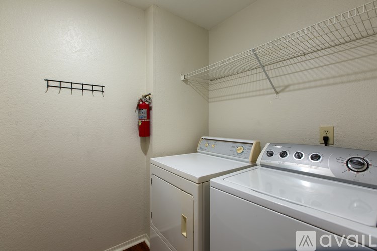 A laundry room with a washer and dryer.