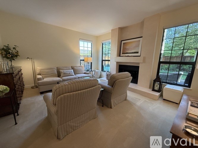 A living room with a fireplace and a couch.