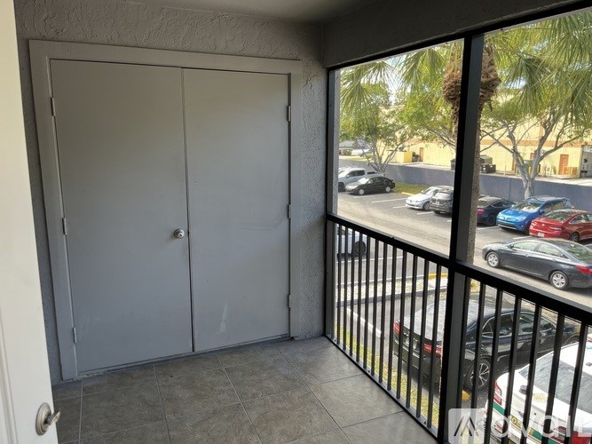 A view of a parking lot from a balcony.