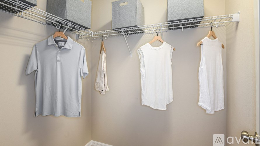 Clothes hanging on a clothes rack.