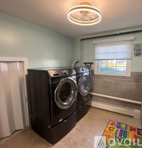 A laundry room with a washer and dryer.