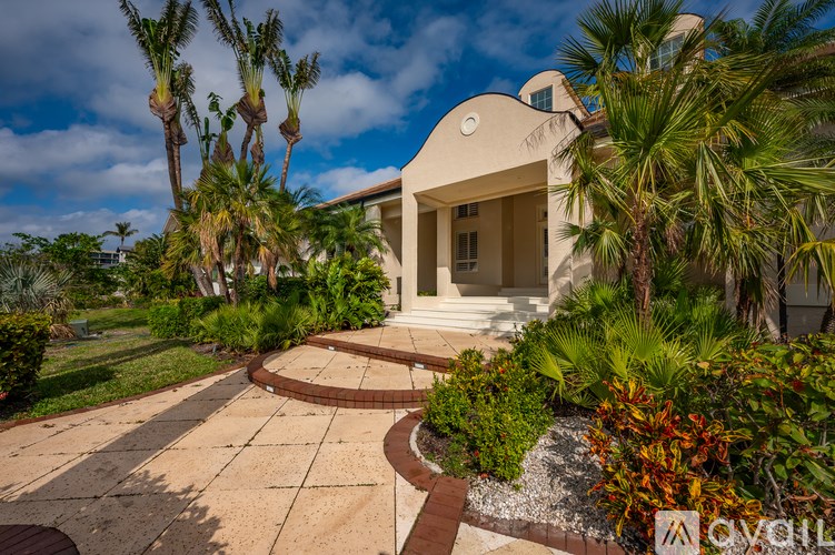 A house with a garden in front of it.