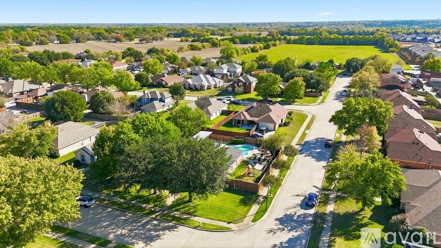 A suburban neighborhood with houses and trees.