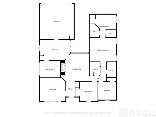 A floor plan of an apartment with a kitchen, dining room, living room, two bedrooms, a bathroom, and a garage.