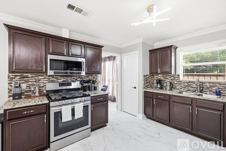 A kitchen with brown cabinets and a white countertop.