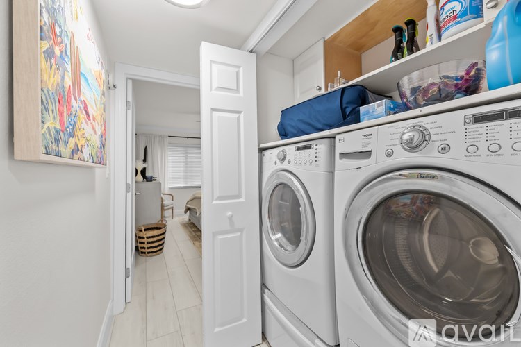 A laundry room with a washer and dryer.