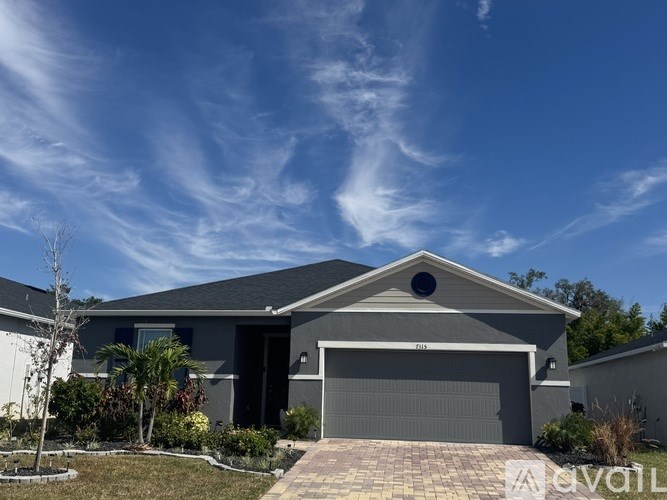 A house with a driveway and a garage door.