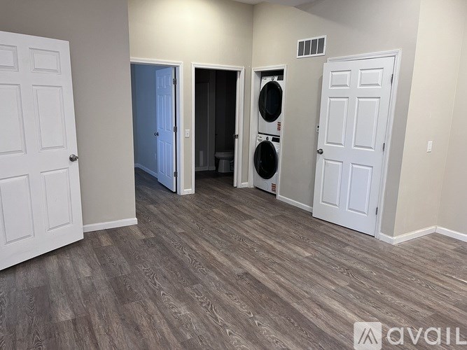 A room with a washer and dryer in it.