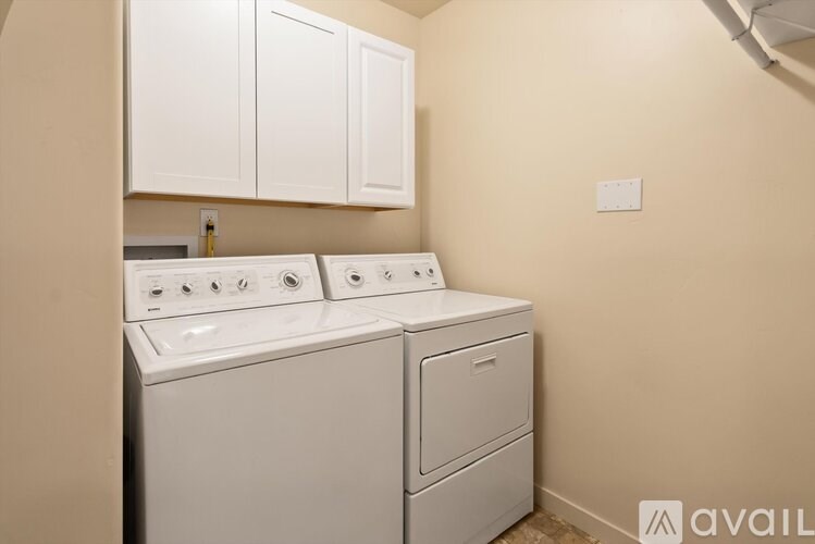 A washer and dryer in a small laundry room.