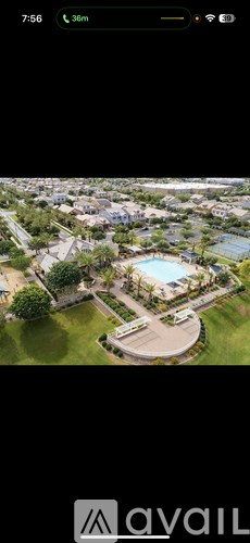 A bird's eye view of a residential area with a swimming pool.