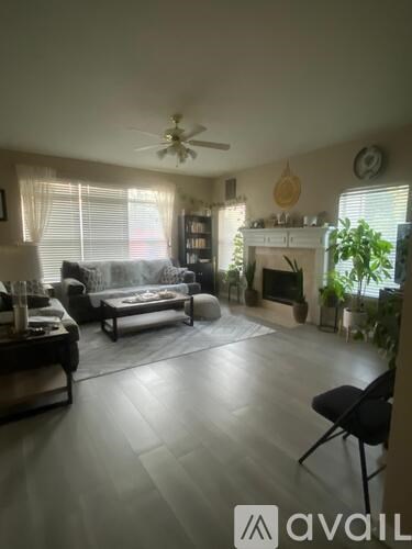 A living room with a fireplace and a couch.