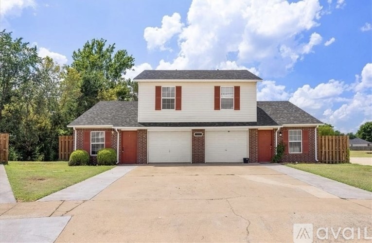 A house with a red garage door is for sale.