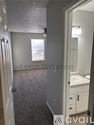 A bathroom with a sink and mirror.