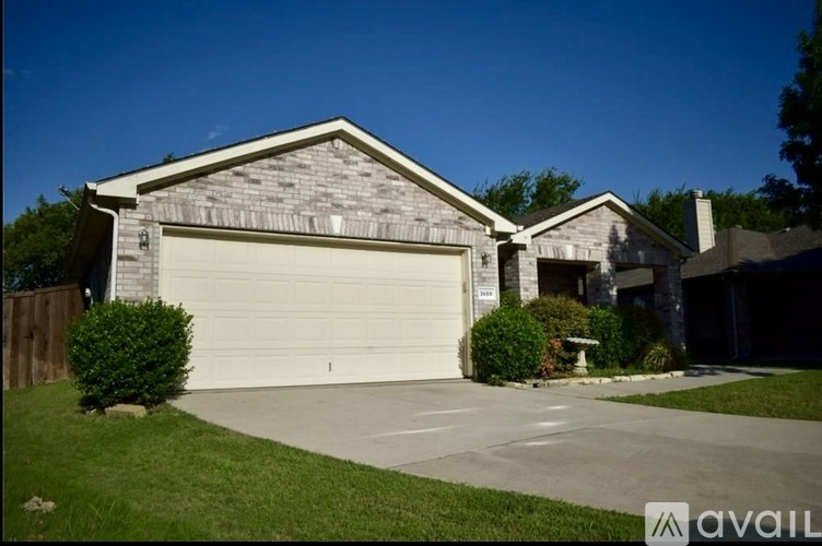 A house with a garage and a driveway.