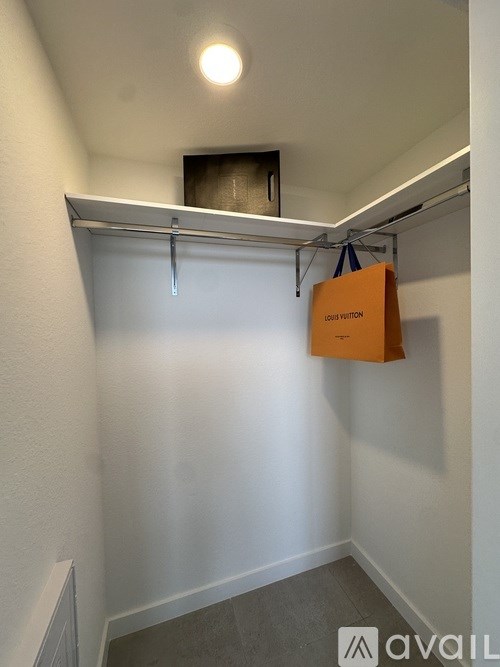 A small room with a hanging sign that says Louis Vivon.