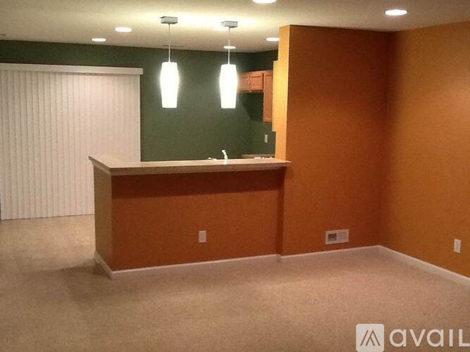 A reception area with a counter and a green wall.