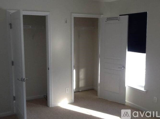 A room with two doors and a window.