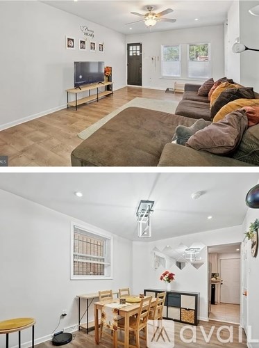 A living room with a couch and a television, and a dining room with a table and chairs.