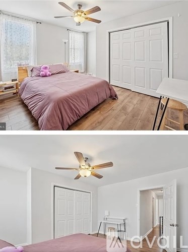 A bedroom with a bed and a ceiling fan.