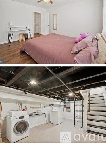 A bedroom with a bed and a washing machine in a laundry room.