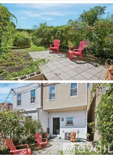 Two red chairs are placed on a patio.