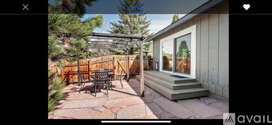 A patio with a table and chairs is shown.