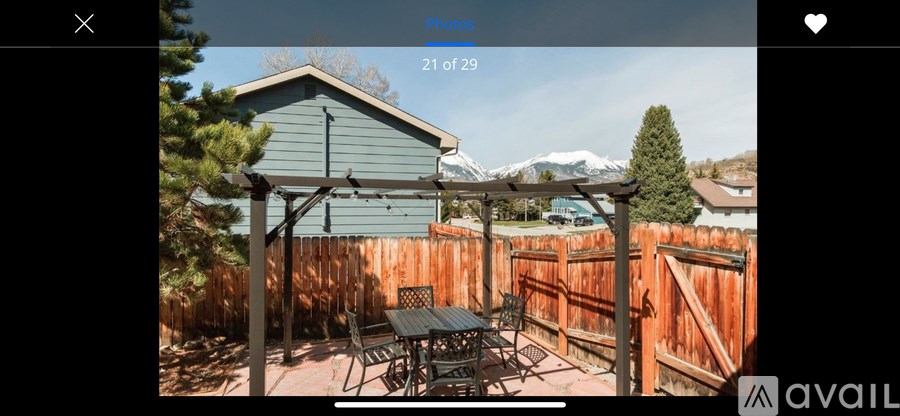 A patio with a table and chairs is shown in the image.