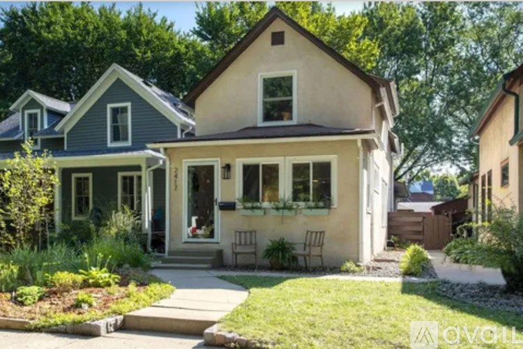 A house with a front yard and a porch.