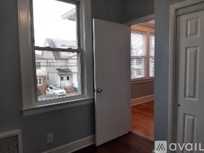 A room with a window and a door.